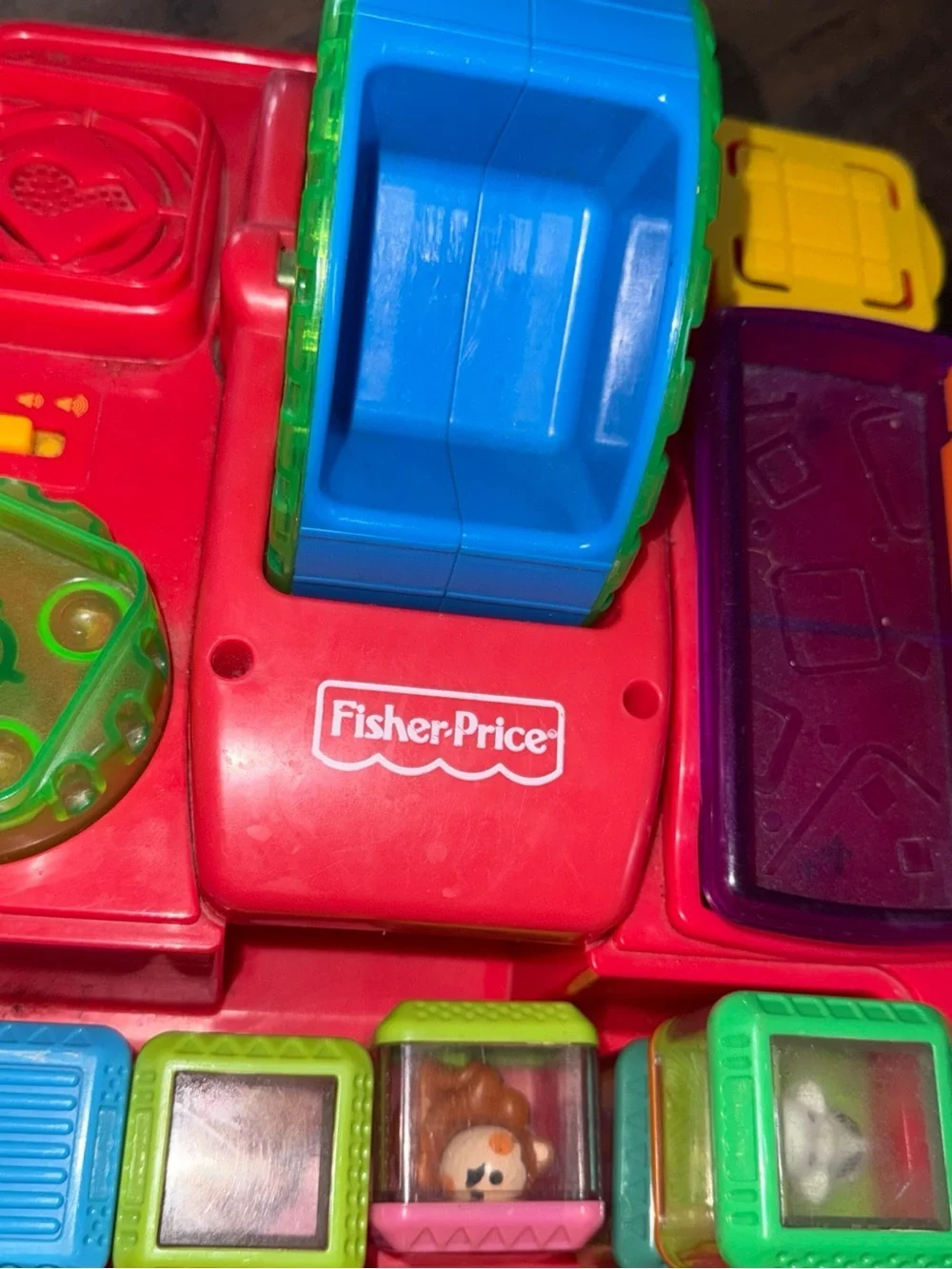 Vintage Fisher-Price Peek-a-boo Pull Toy with Green Handle and Blue Wheels
